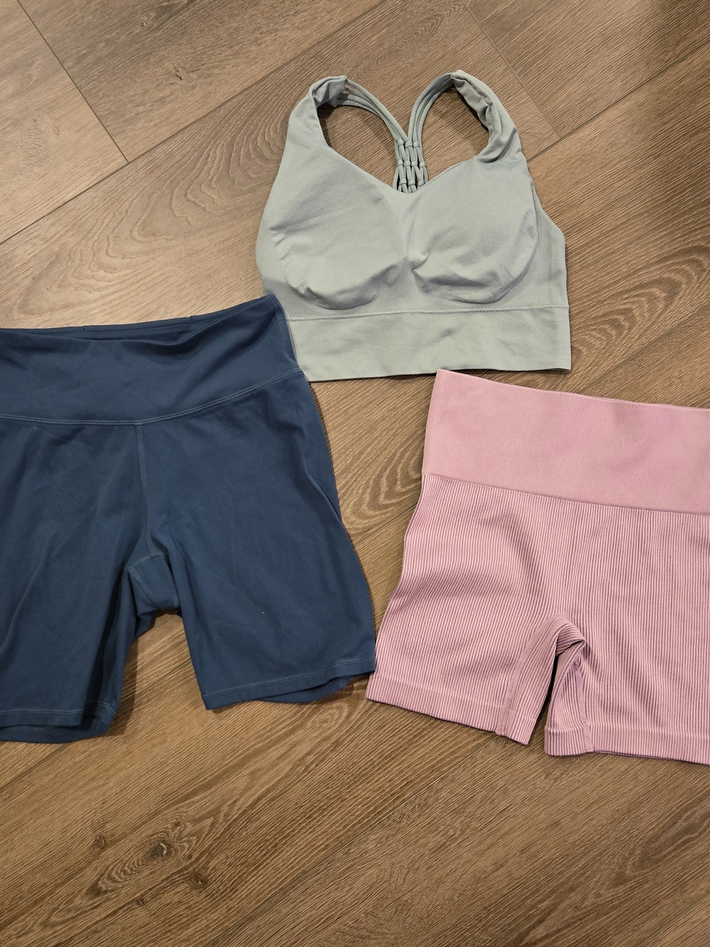 Bundle Of Women’s High-Rise Ribbed Pink Bike Shorts, Navy Shorts And Sports Bra